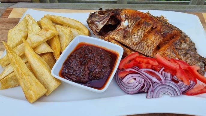 Fried Yam with a whole tilapia fish